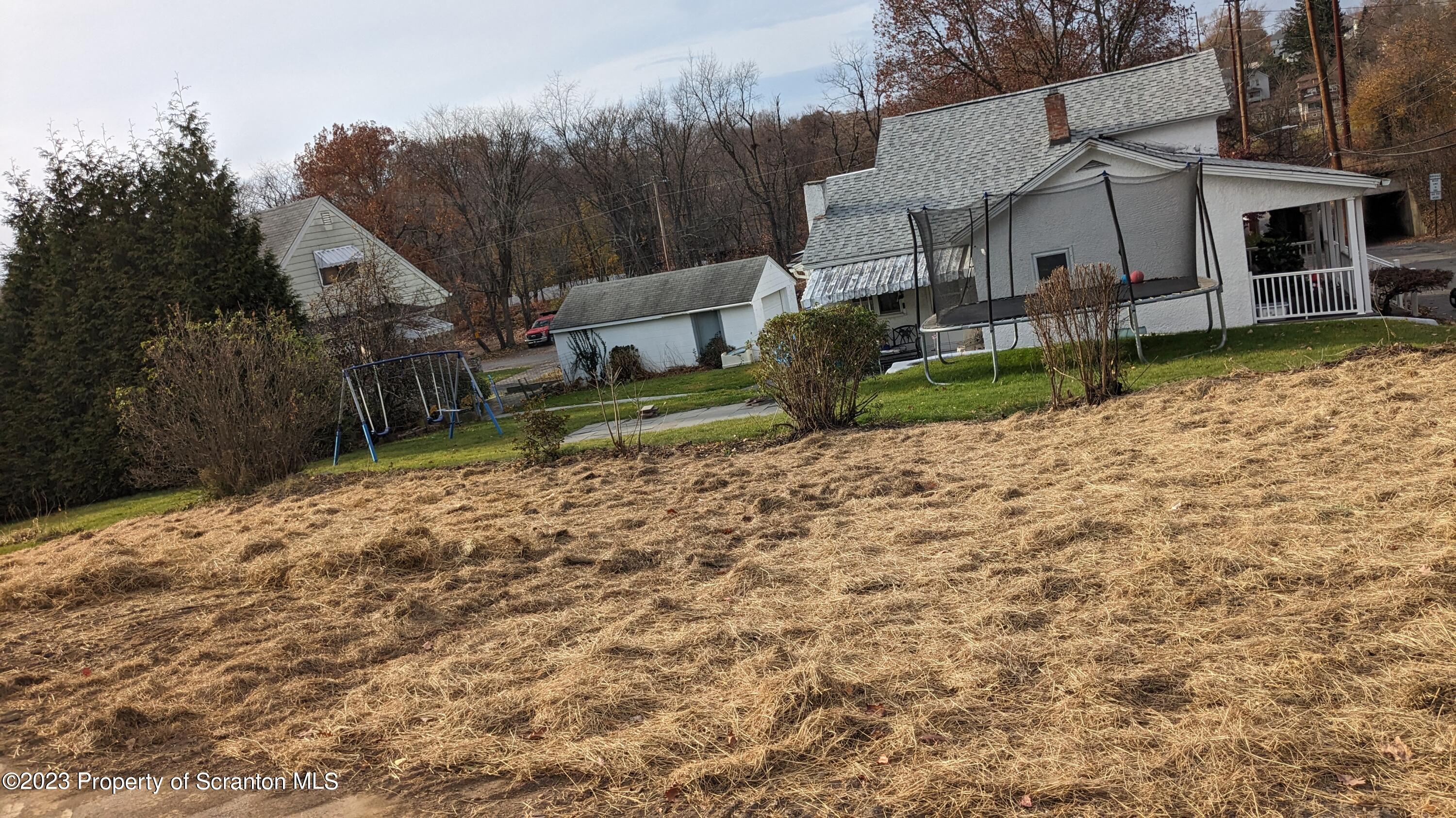 2122 Ash Street Scranton, PA 18510 - Photo 5 of 7 a view of a house with a yard and pathway