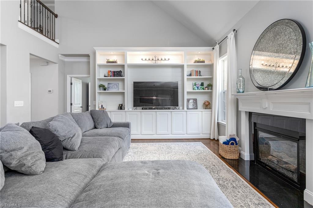 7779 Sutter Road Greensboro, NC 27455 - Photo 8 of 45 Gas fireplace anchors this lovely open space