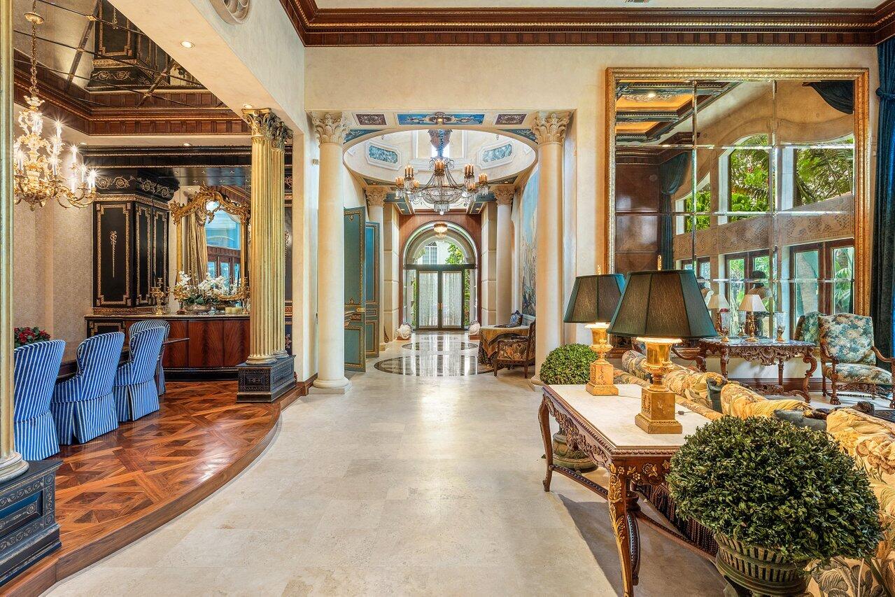 428 Addison Park Lane Boca Raton, FL 33432 - Photo 14 of 48 a living room with furniture a window and a chandelier
