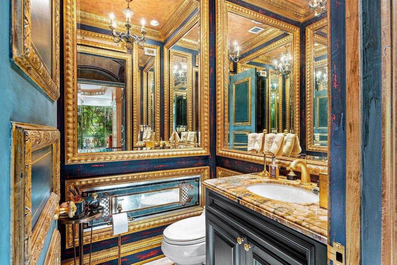 428 Addison Park Lane Boca Raton, FL 33432 - Photo 15 of 48 a bathroom with a granite countertop sink and a mirror