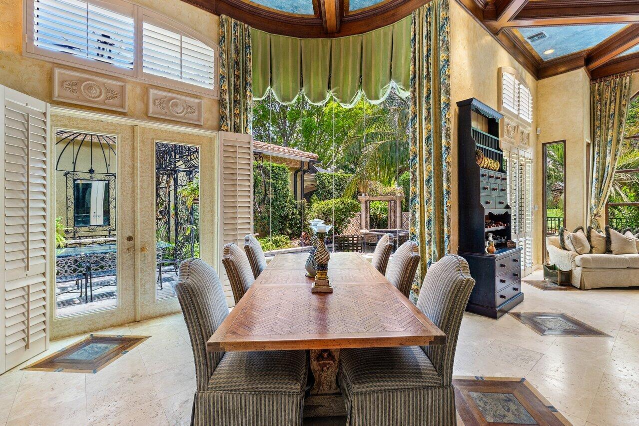 428 Addison Park Lane Boca Raton, FL 33432 - Photo 16 of 48 a view of an outdoor dining space with a table and chairs