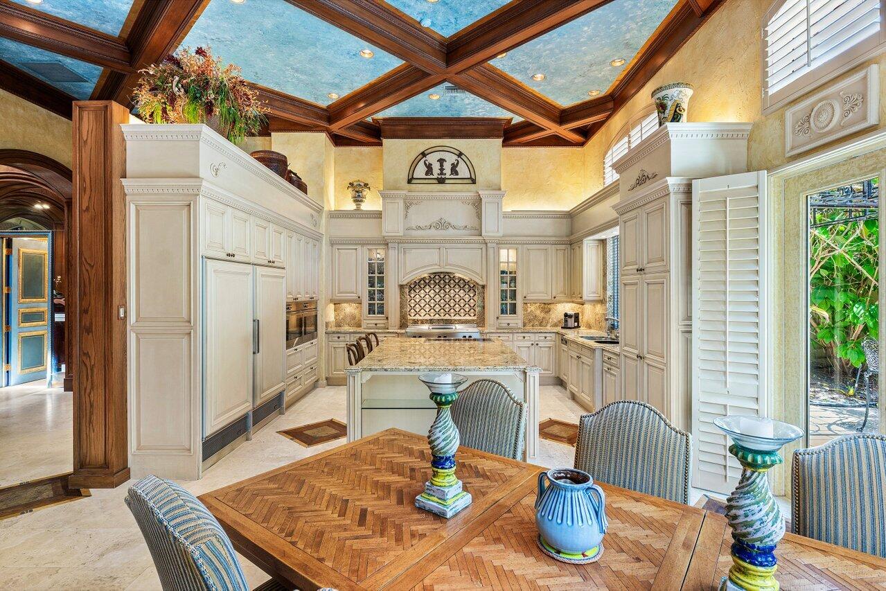 428 Addison Park Lane Boca Raton, FL 33432 - Photo 18 of 48 a view of a dining room with furniture a chandelier and wooden floor