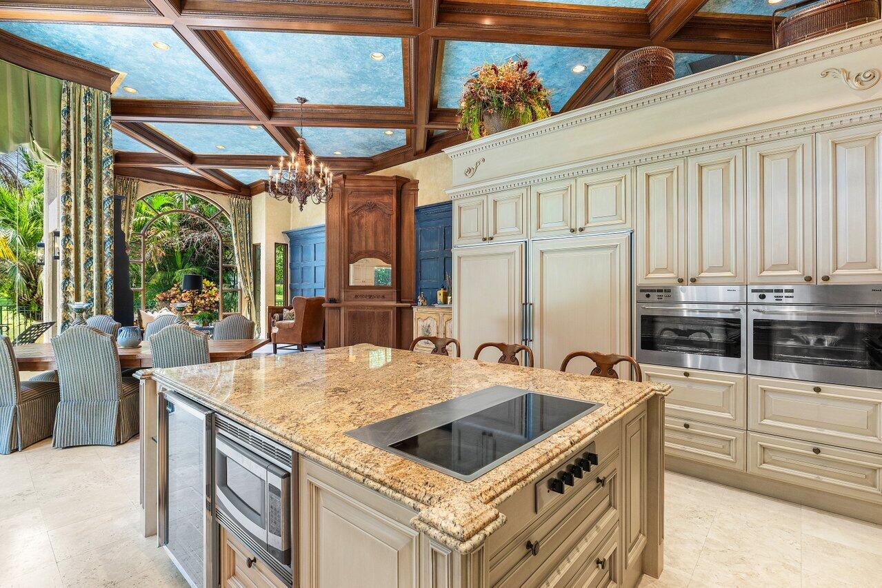 428 Addison Park Lane Boca Raton, FL 33432 - Photo 20 of 48 a kitchen that has a sink a stove and a microwave oven in it