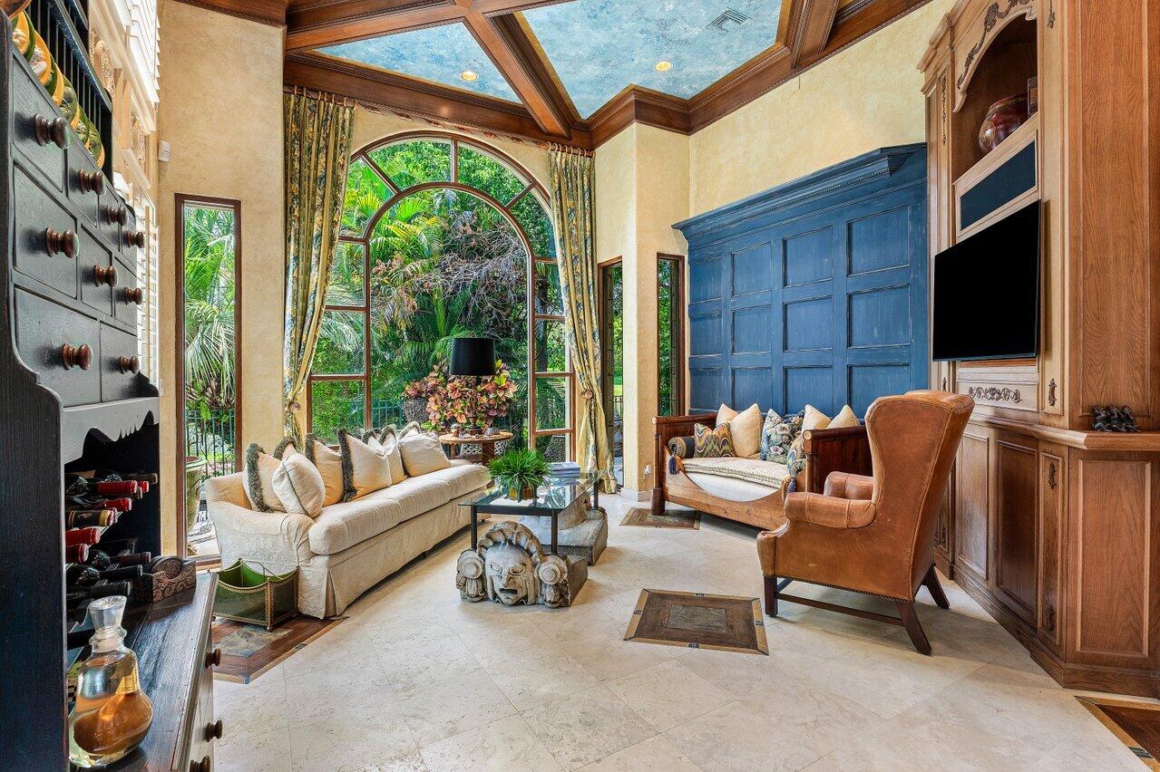 428 Addison Park Lane Boca Raton, FL 33432 - Photo 21 of 48 a living room with furniture a floor to ceiling window and a flat screen tv