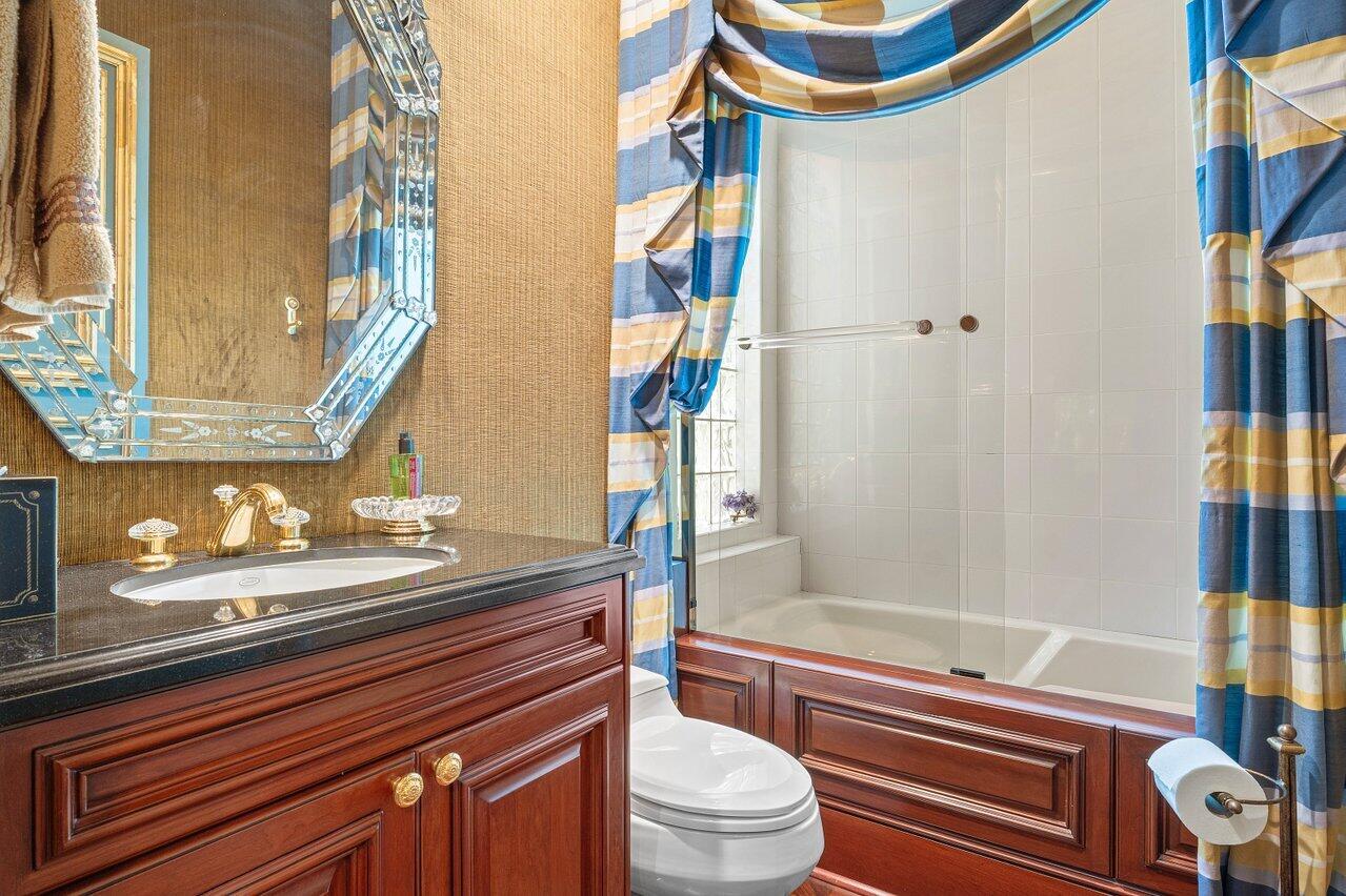 428 Addison Park Lane Boca Raton, FL 33432 - Photo 30 of 48 a bathroom with a sink a toilet and shower curtain