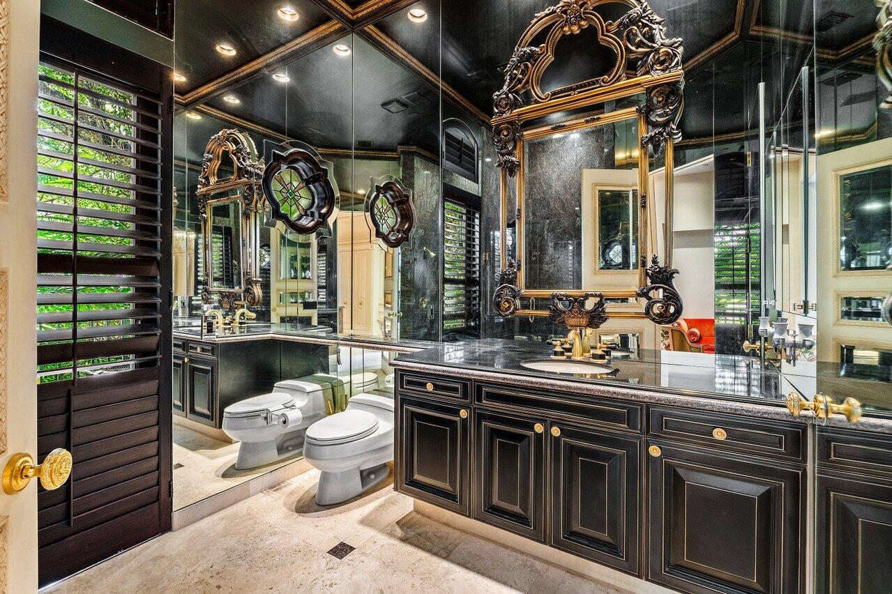 428 Addison Park Lane Boca Raton, FL 33432 - Photo 33 of 48 a kitchen with a sink and wooden cabinets