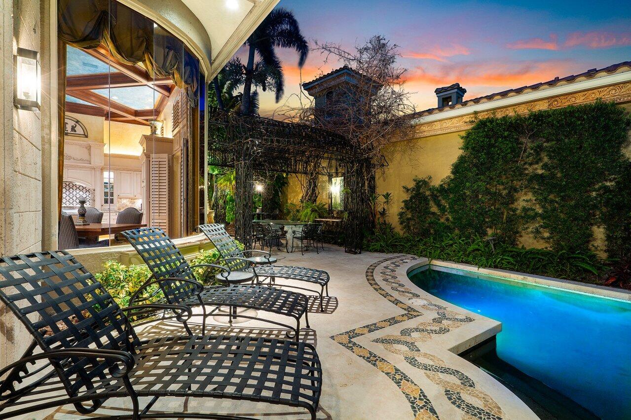 428 Addison Park Lane Boca Raton, FL 33432 - Photo 46 of 48 a view of a patio with couches table and chairs and potted plants