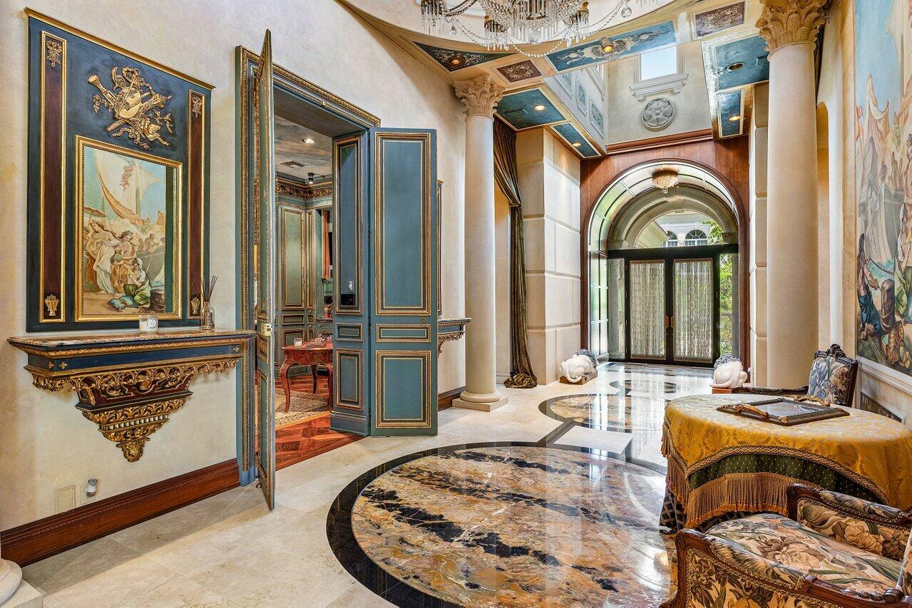 428 Addison Park Lane Boca Raton, FL 33432 - Photo 8 of 48 a view of a hallway with a dining table and chairs