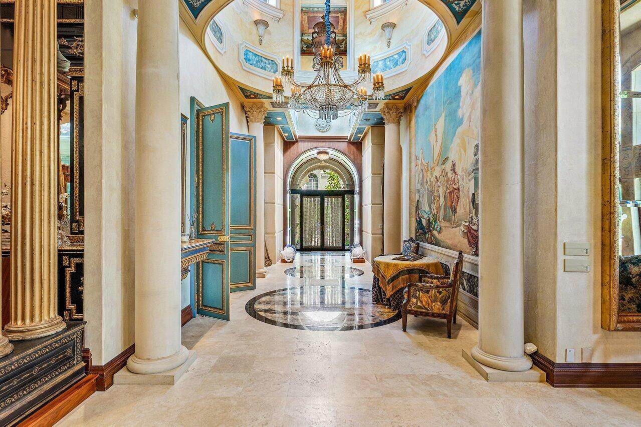 428 Addison Park Lane Boca Raton, FL 33432 - Photo 9 of 48 a view of hall way with furniture and chandelier