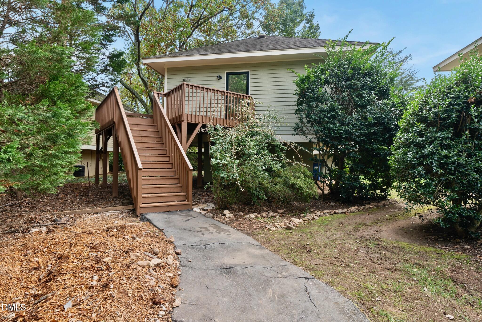 3634 Mill Run Raleigh, NC 27612 - Photo 2 of 18 a view of a house with a yard