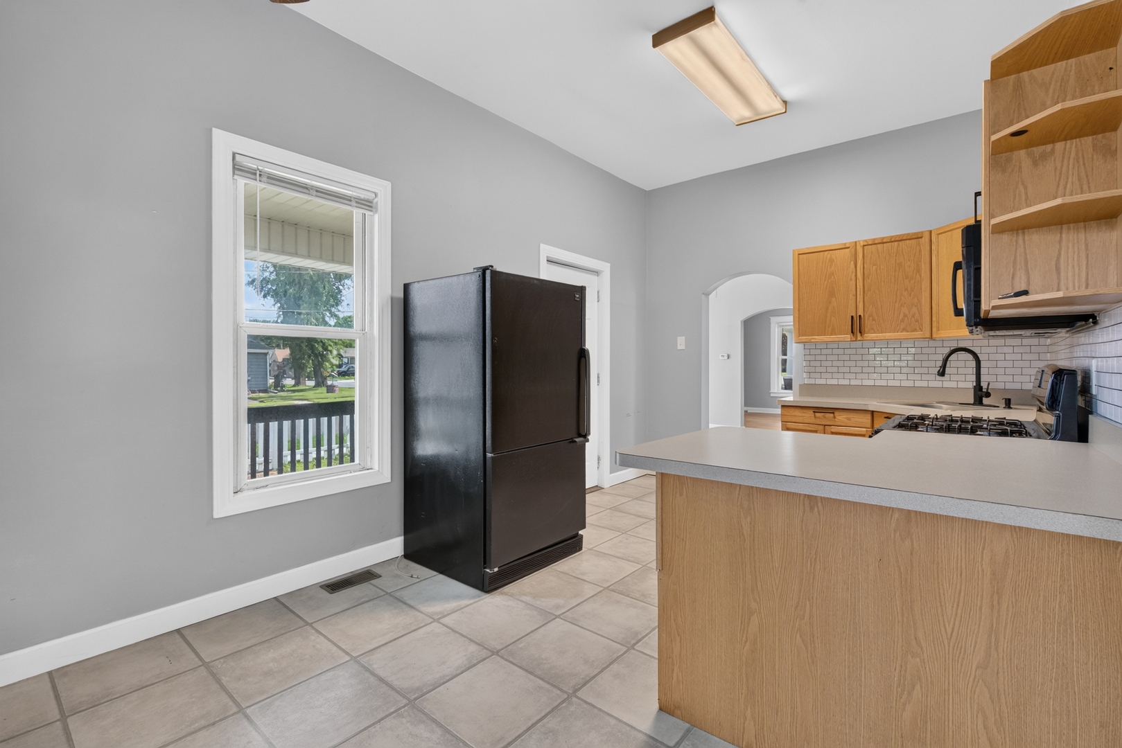 1128 Butler Street Morris, IL 60450 - Photo 14 of 28 a kitchen with stainless steel appliances a refrigerator and a sink