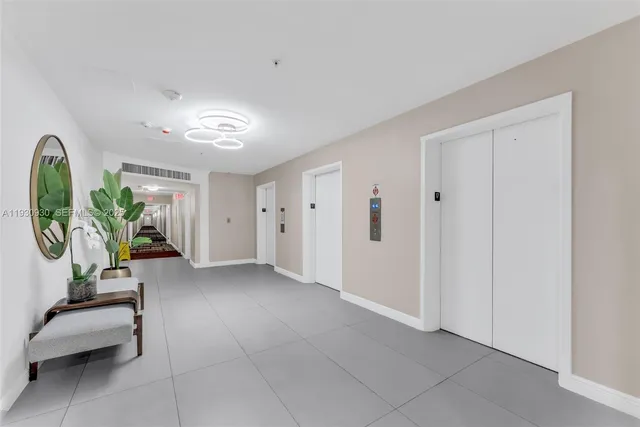 a view of a livingroom with table & chairs