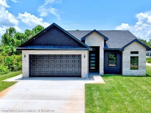 a front view of a house with a garage