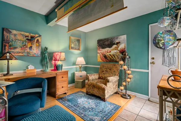 a living room with furniture and a rug