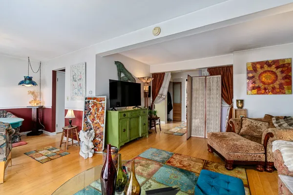 a bedroom with furniture and a flat screen tv