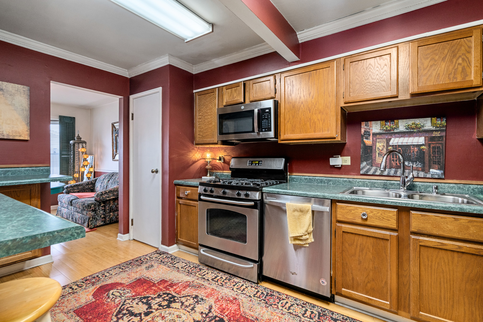 130 Jerome Lane Bolingbrook, IL 60440 - Photo 7 of 32 a kitchen with stainless steel appliances granite countertop a stove and cabinets