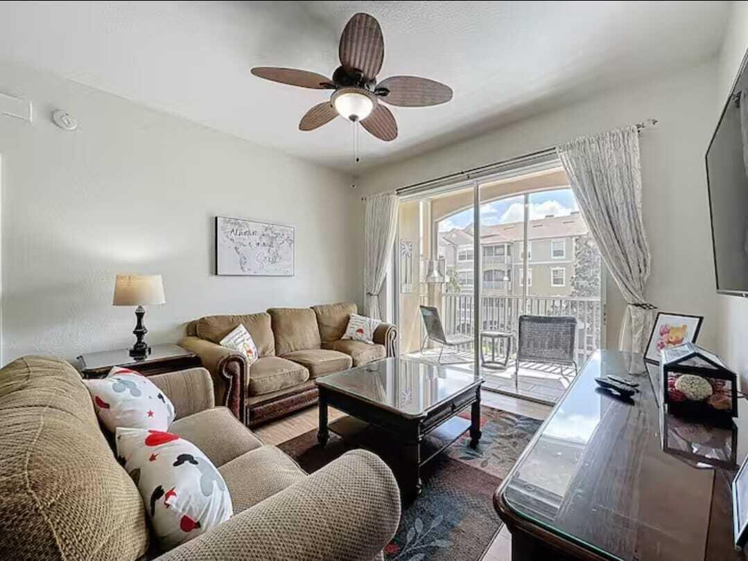 2784 Almaton Loop, Unit 301 Kissimmee, FL 34747 - Photo 4 of 37 a living room with furniture