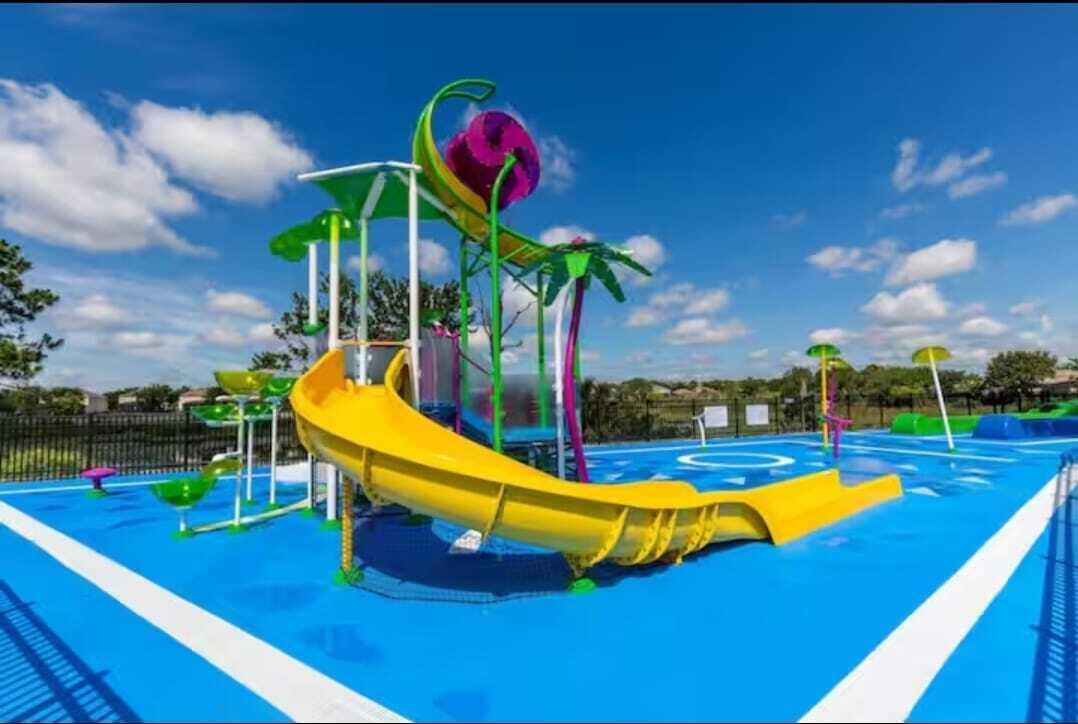2784 Almaton Loop, Unit 301 Kissimmee, FL 34747 - Photo 7 of 37 a view of a swimming pool with a yard and potted plants