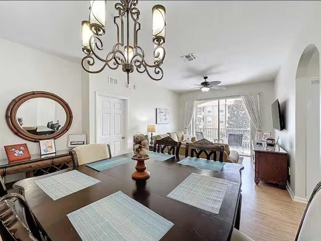 2784 Almaton Loop, Unit 301 Kissimmee, FL 34747 - Photo 10 of 37 a living room with furniture and a large window