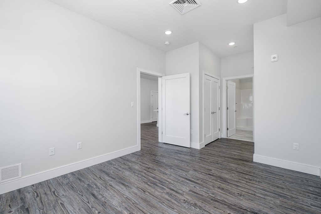 16 Laurel Street, Unit 201 Everett, MA 02149 - Photo 16 of 27 a view of an empty room with wooden floor