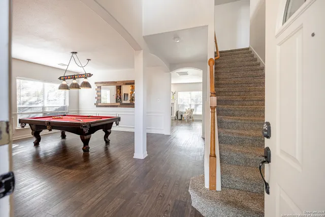 a room with furniture and wooden floor