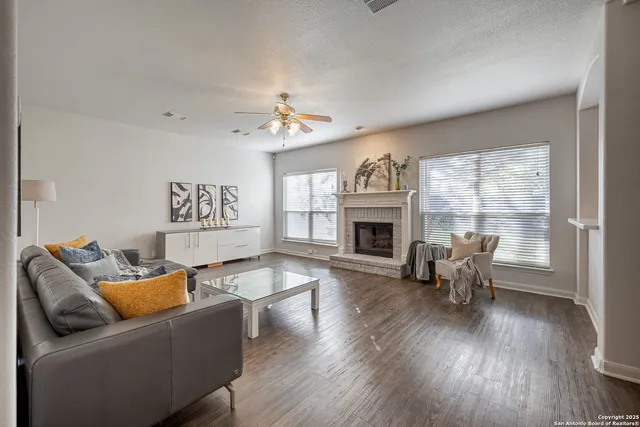 a living room with furniture and a fireplace