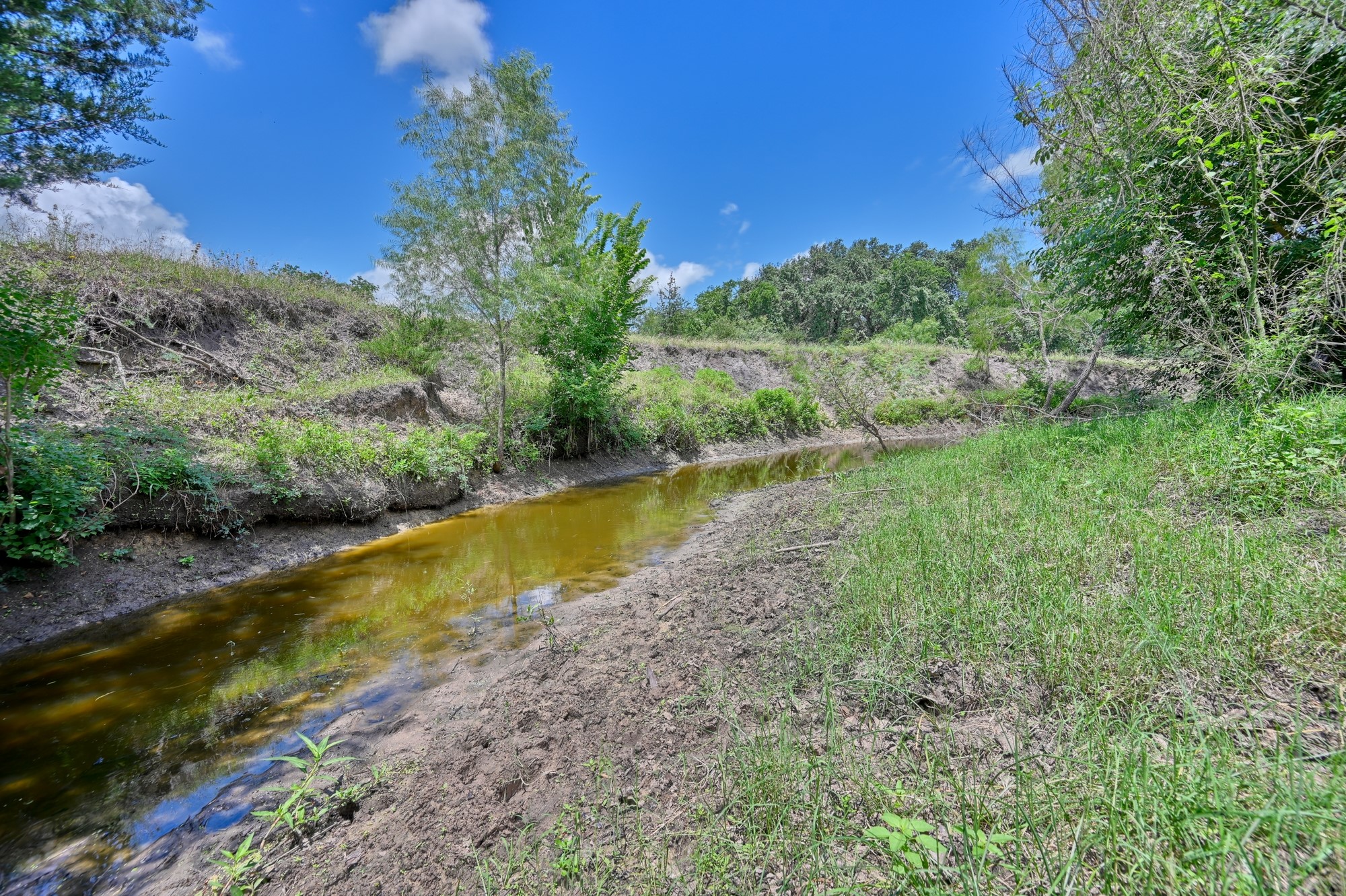 5208 Mensik Road Schulenburg, TX 78956 - Photo 17 of 18 a view of a lake with a yard