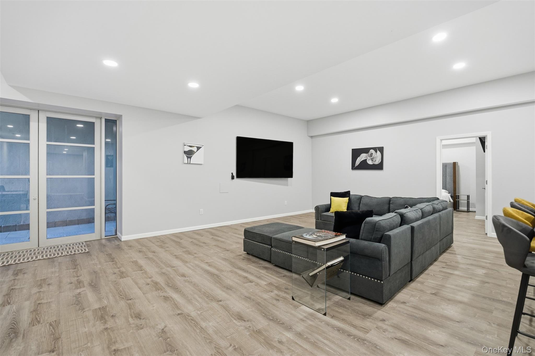 33 A Newtown Road Hampton Bays, NY 11946 - Photo 45 of 50 Living area featuring recessed lighting and light wood-type flooring