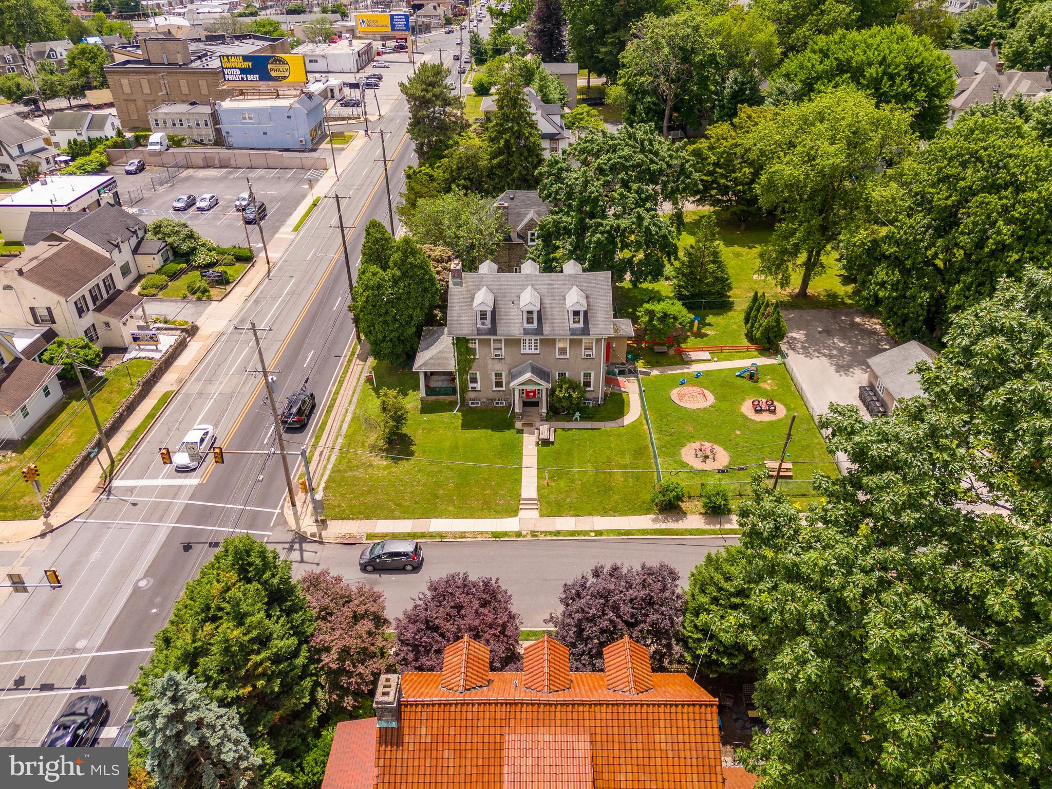 223 East Park Road Havertown, PA 19083 - Photo 14 of 37 an aerial view of a house with a garden statue and large trees