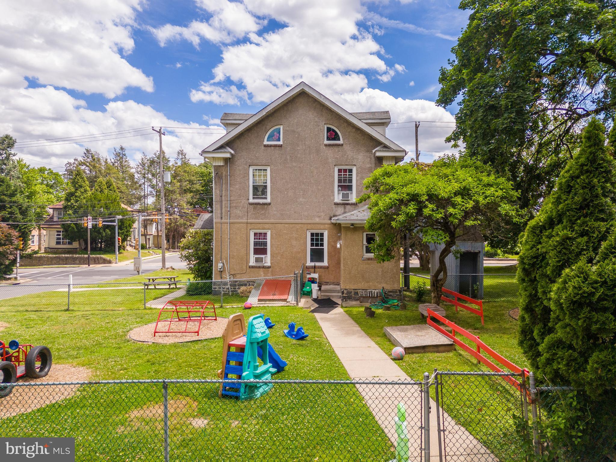 223 East Park Road Havertown, PA 19083 - Photo 2 of 37 a front view of a house with swimming pool and a garden