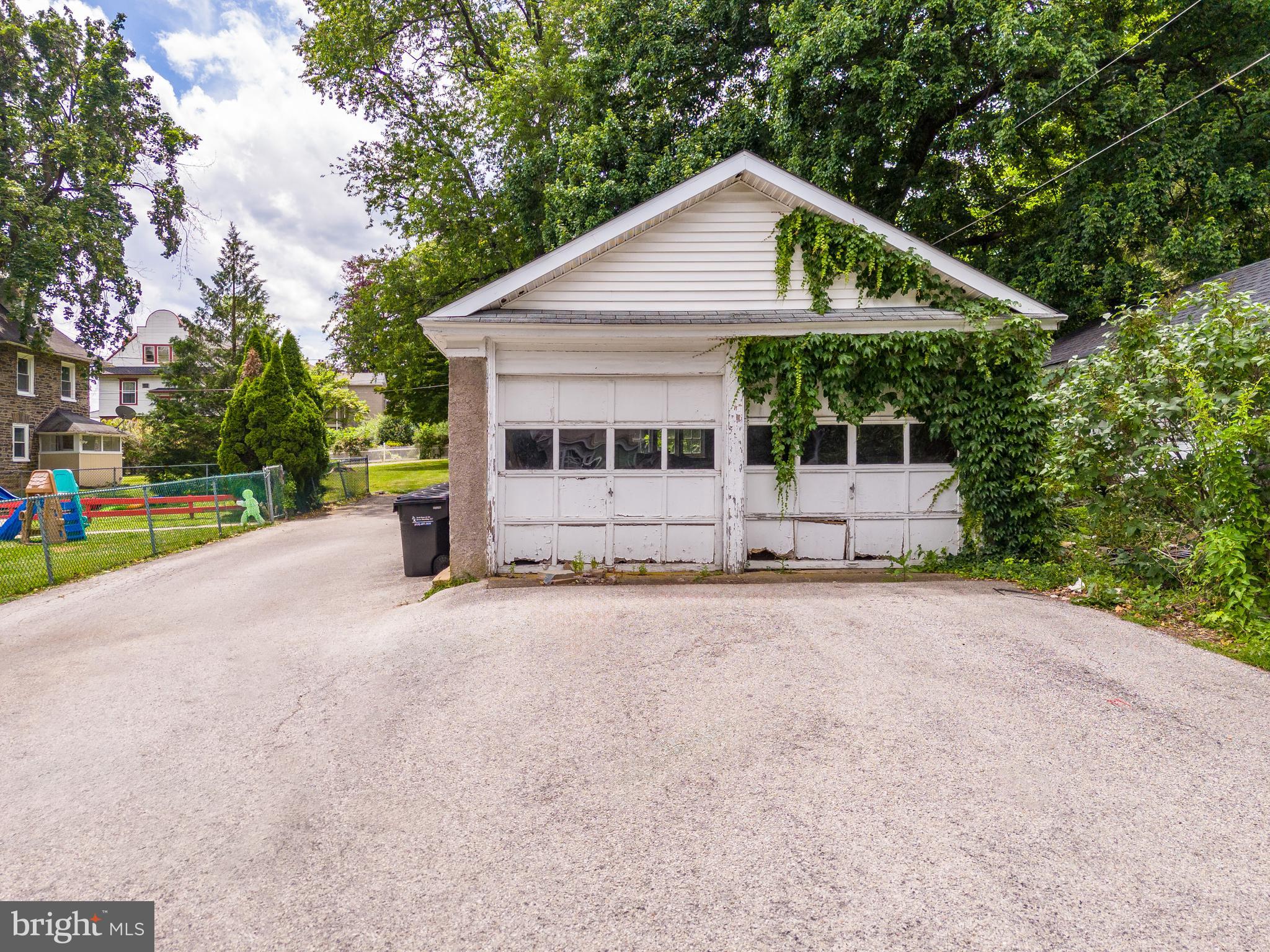 223 East Park Road Havertown, PA 19083 - Photo 7 of 37 a front view of a house with a yard and garage