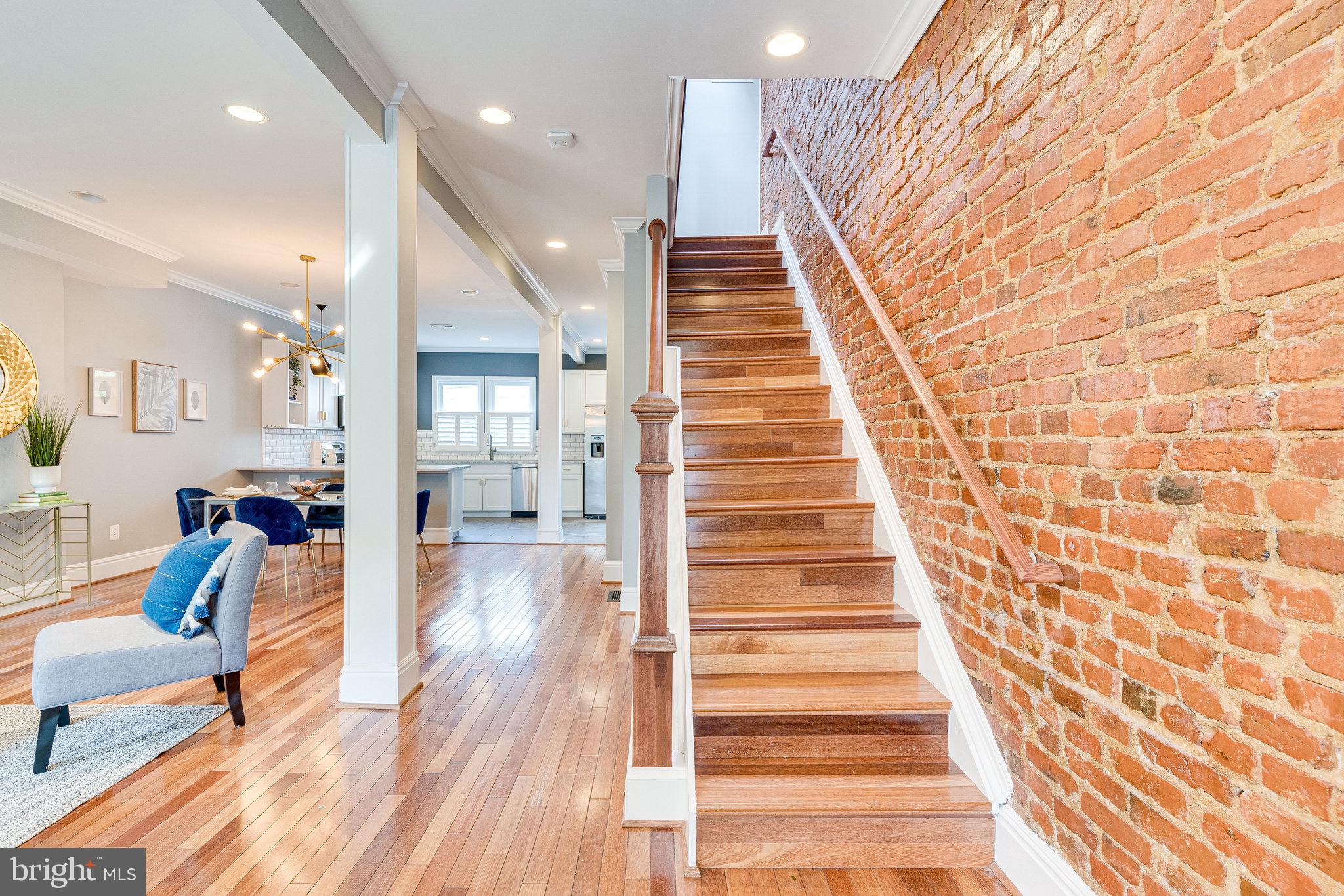 1026 7th Street Northeast Washington, DC 20002 - Photo 7 of 70 Entryway with exposed brick and custom railing