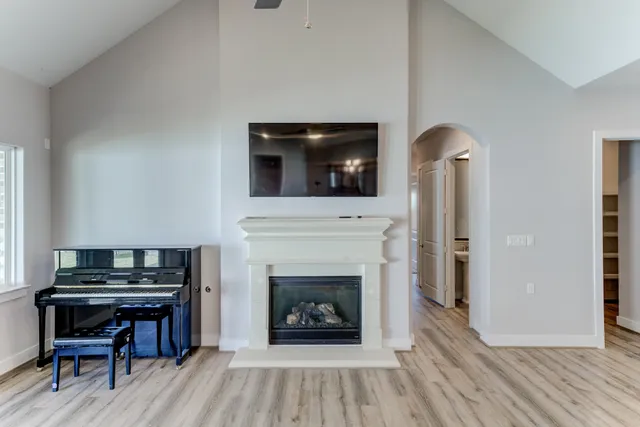 a living room with furniture and a fireplace