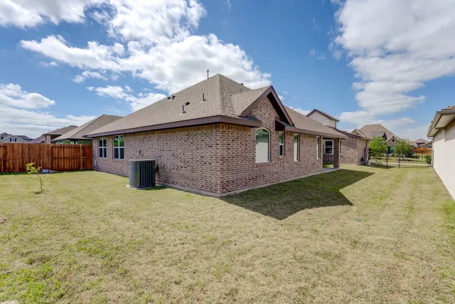 a backyard of a house with lots of green space