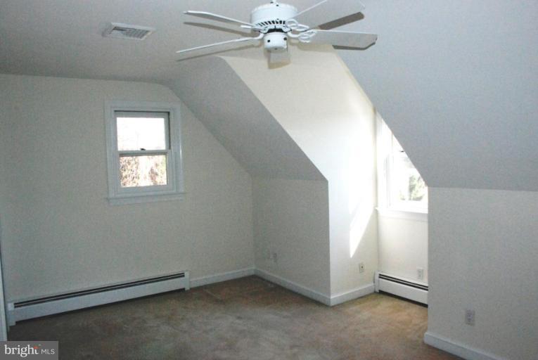 15500 Tierra Drive Silver Spring, MD 20906 - Photo 17 of 21 an empty room with windows and fan