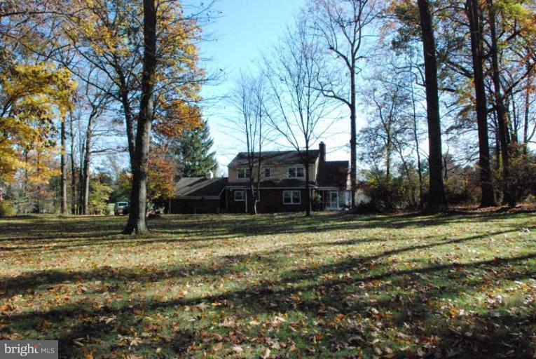 15500 Tierra Drive Silver Spring, MD 20906 - Photo 9 of 21 a view of a backyard with large trees