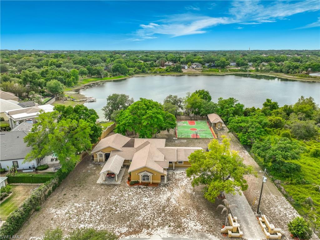 4210 South Hiawassee Road Orlando, FL 32835 - Photo 3 of 49 an aerial view of a house with a lake view