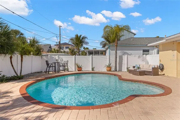 a view of a swimming pool with a patio