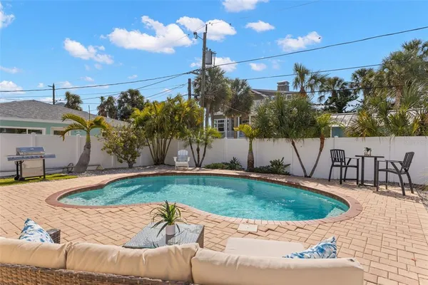 a view of a swimming pool with a patio