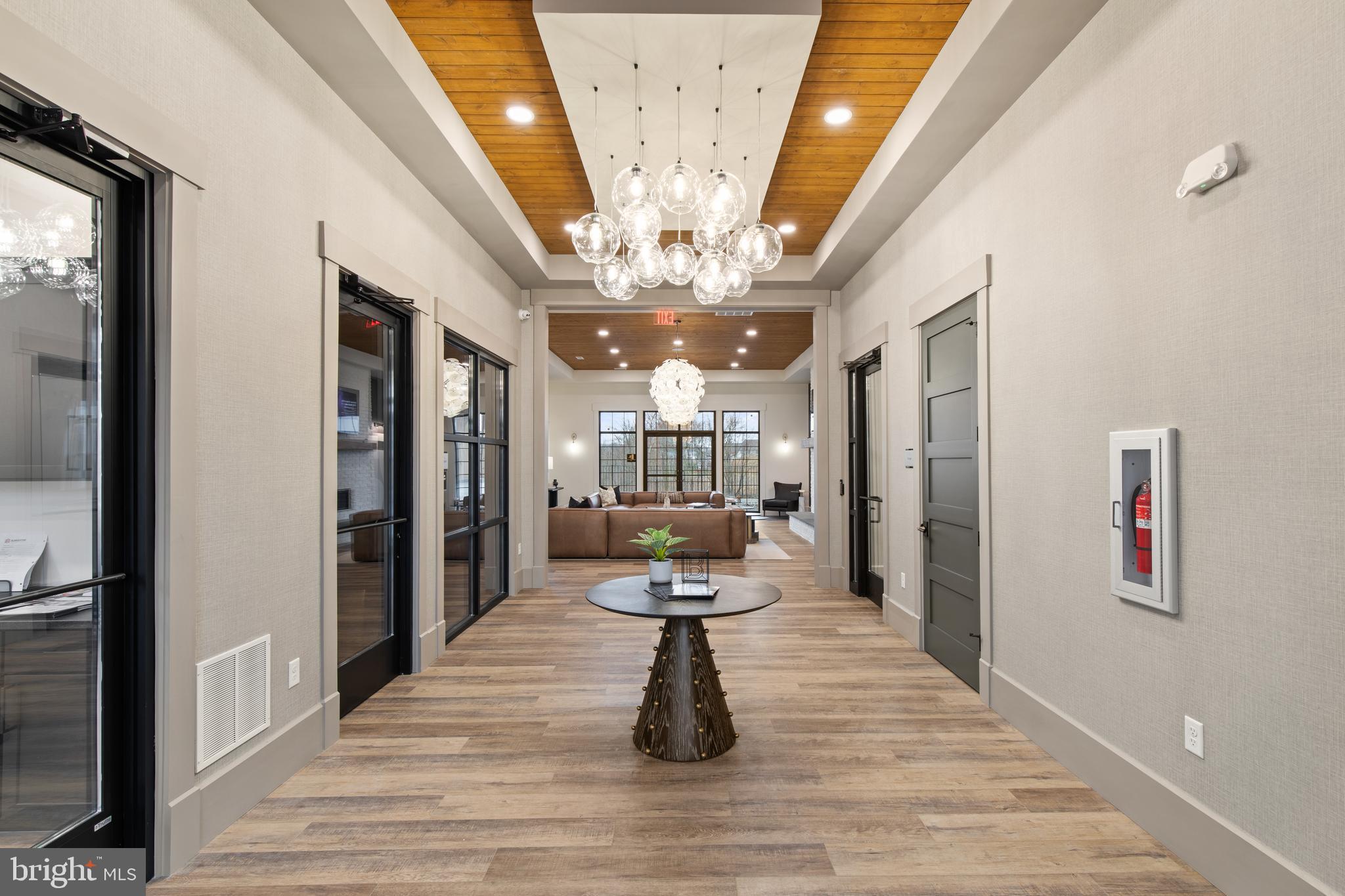 2320 Hadley Boulevard, Unit 101 Enola, PA 17025 - Photo 20 of 31 a view of a hallway view with wooden floor and chandelier