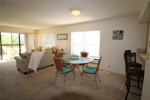 a kitchen that has a sink and a stove top oven