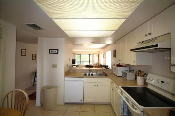 a room with chairs and windows