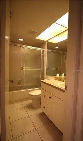 a view of a building with a yard and plants