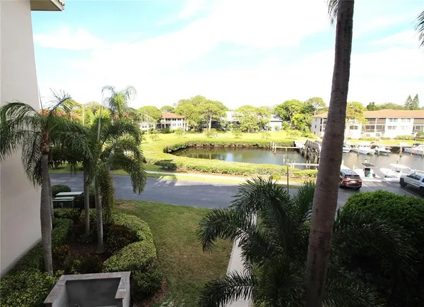 a view of house with yard swimming pool and outdoor seating