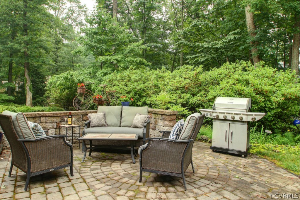 14101 Grangewood Road Midlothian, VA 23113 - Photo 16 of 17 a patio with patio a couch and trees