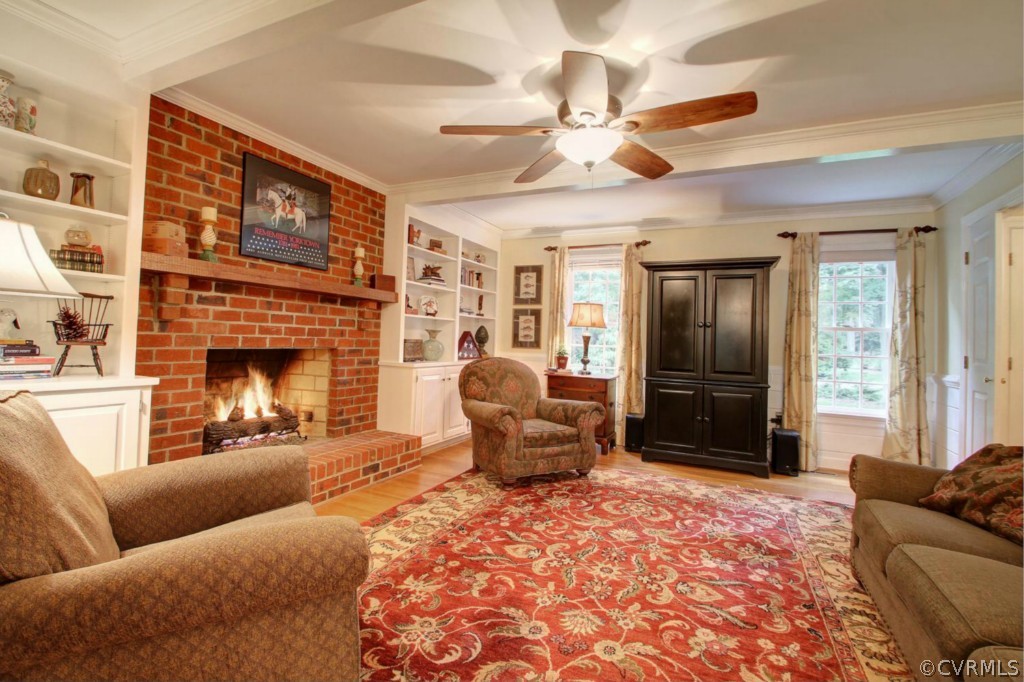 14101 Grangewood Road Midlothian, VA 23113 - Photo 8 of 17 a living room with furniture windows and a fireplace
