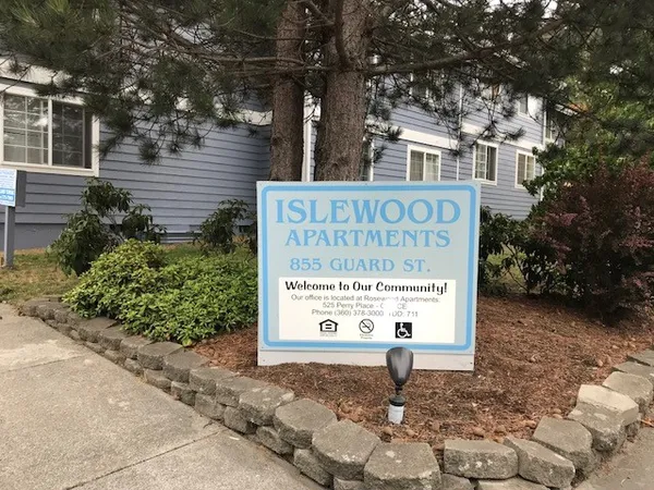 a sign broad on the side of the road