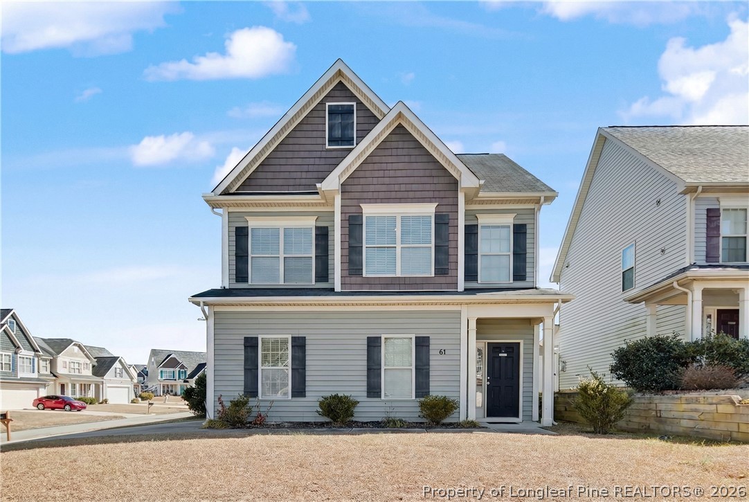 61 Bicentennial Way Cameron, NC 28326 - Photo 1 of 49 a front view of a house with yard and parking