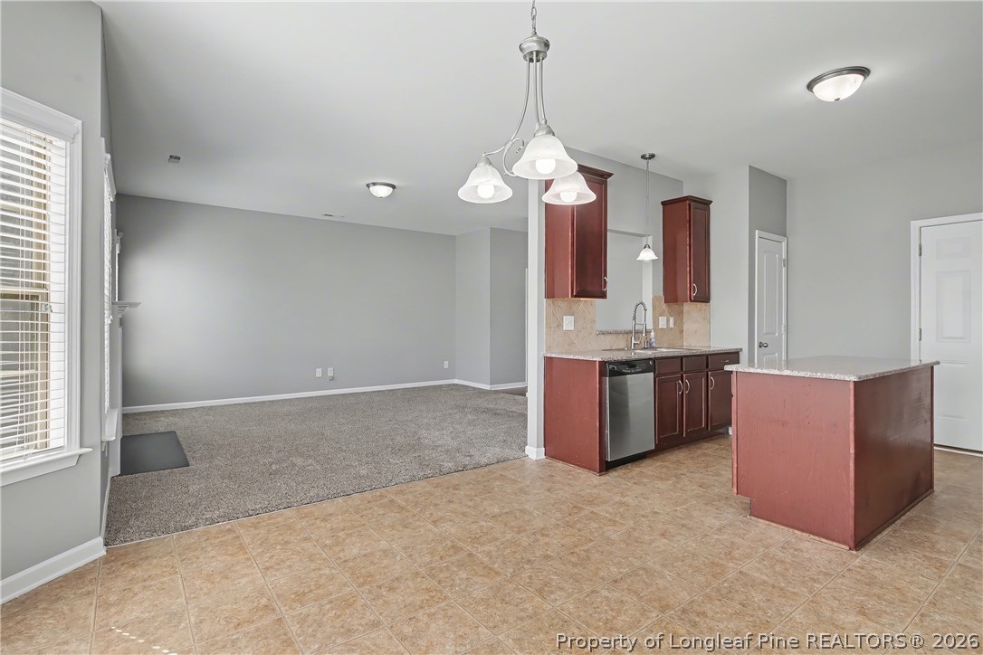 61 Bicentennial Way Cameron, NC 28326 - Photo 16 of 49 a kitchen with stainless steel appliances a sink a counter space and cabinets