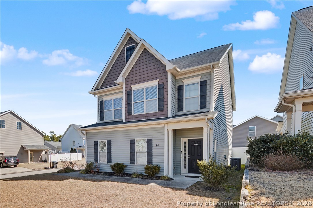 61 Bicentennial Way Cameron, NC 28326 - Photo 2 of 49 a front view of a house with a yard